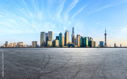 Canvas Print Empty race track and modern skyline and buildings in Shanghai,China