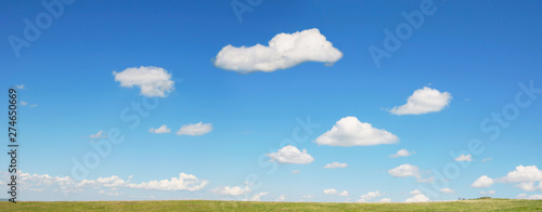 Beautiful summer panoramic view of cloudscape and blue sky over green valley
