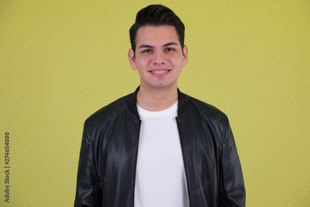 Face of happy young multi ethnic man with leather jacket smiling Face of happy young multi ethnic man with leather jacket smiling