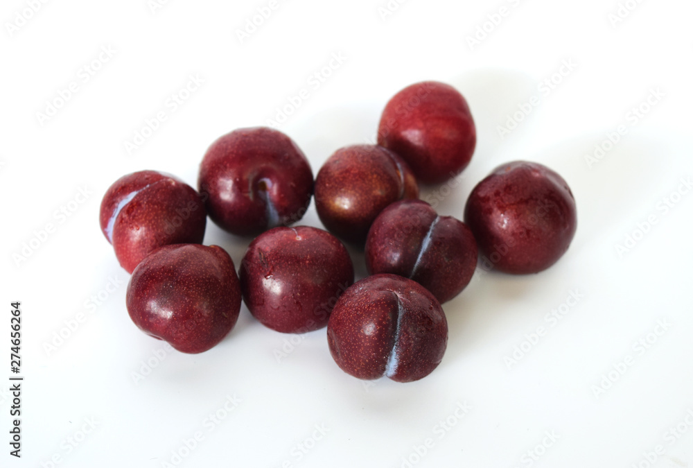 Plum (Prunus domestica L.) Healthy fruit concept White background Plum (Prunus domestica L.) Healthy fruit concept White background
