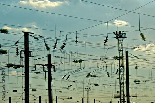 Fototapeta Silhouette of Overhead power lines for trains, Paris, France