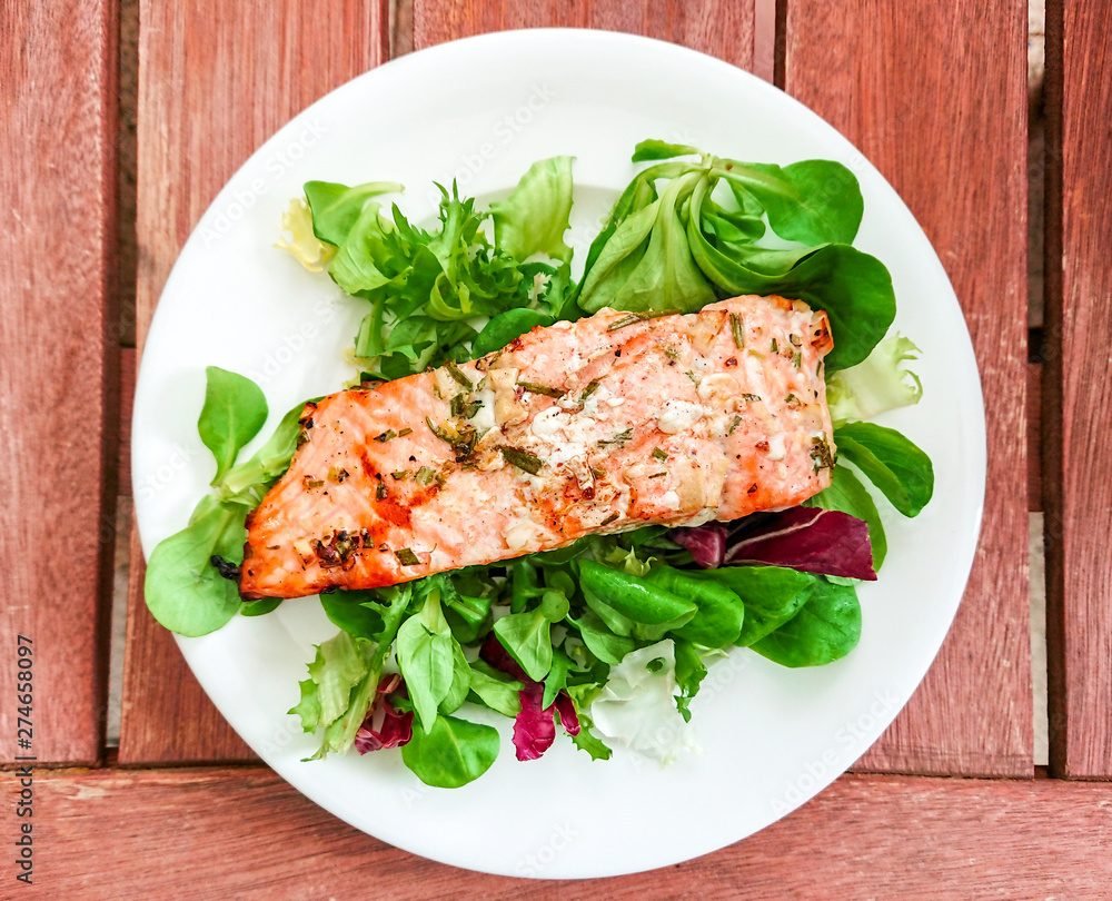 Grilled salmon fillet with fresh green salad Grilled salmon fillet with fresh green salad