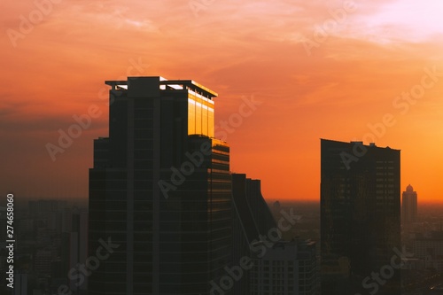 Building in the central business district of the city and sunset background