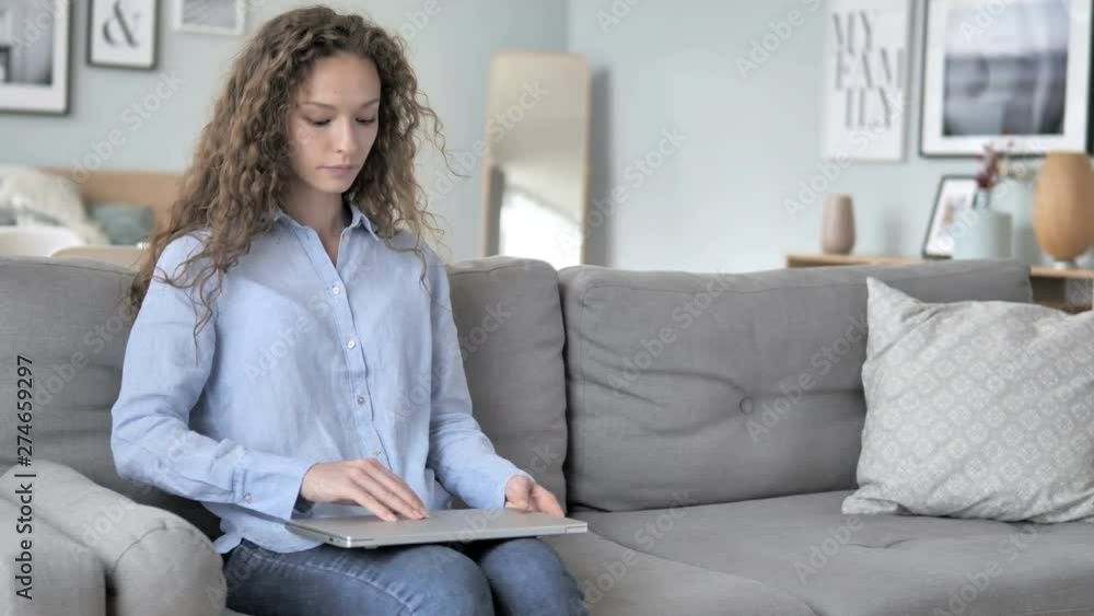 Curly Hair Woman Coming, Sitting and Starting Work on Laptop Curly Hair Woman Coming, Sitting and Starting Work on Laptop
