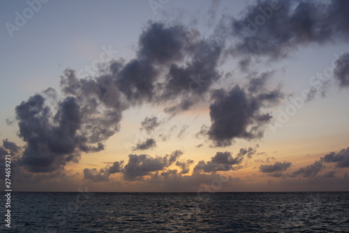 Fototapeta Naklejka Na Ścianę i Meble -  Cloudy sky in the evening over the Indian Ocean. Maldives.
