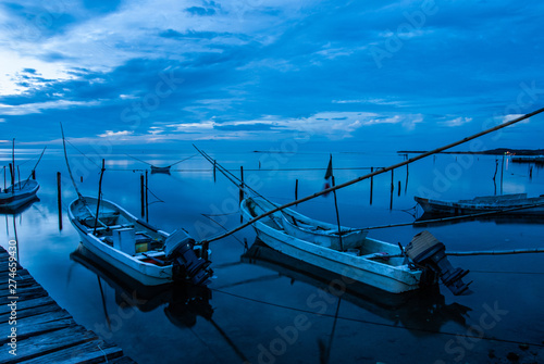 Canoes and the blue sunset in Campeche Mexico. photo