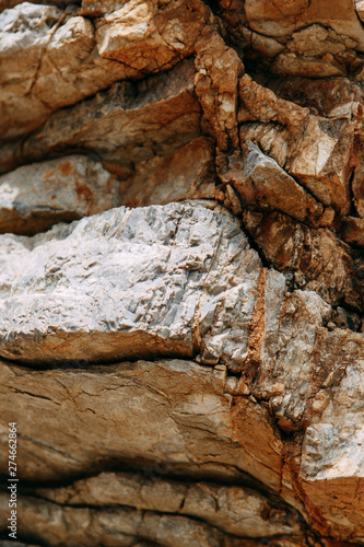  Stone walls and rocky shore. Rocks in the Bay of Budva, Montenegro.