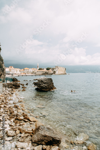 Stone walls and rocky shore. Rocks in the Bay of Budva, Montenegro.