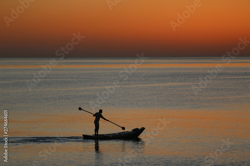 A fisherman in the middle of the sea
