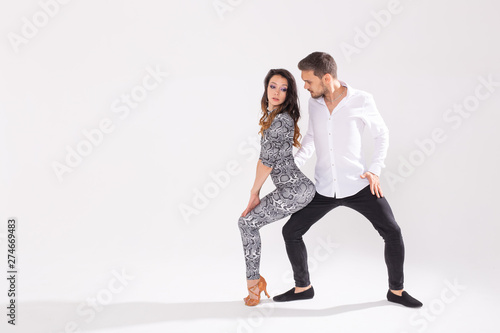 Salsa, kizomba, tango and bachata dancers on white background with copy space. Social dance concept