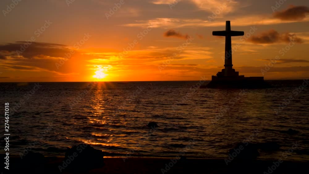 Day to night sunset timelapse of a memorial off a tropical island (Camiguin Sunken Cemetery, Philippines) Day to night sunset timelapse of a memorial off a tropical island (Camiguin Sunken Cemetery, Philippines)
