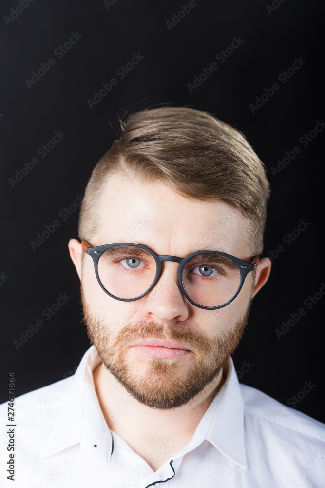 Portrait, guy and business people concept - Handsome man with glasses in white shirt looking at camera Portrait, guy and business people concept - Handsome man with glasses in white shirt looking at camera