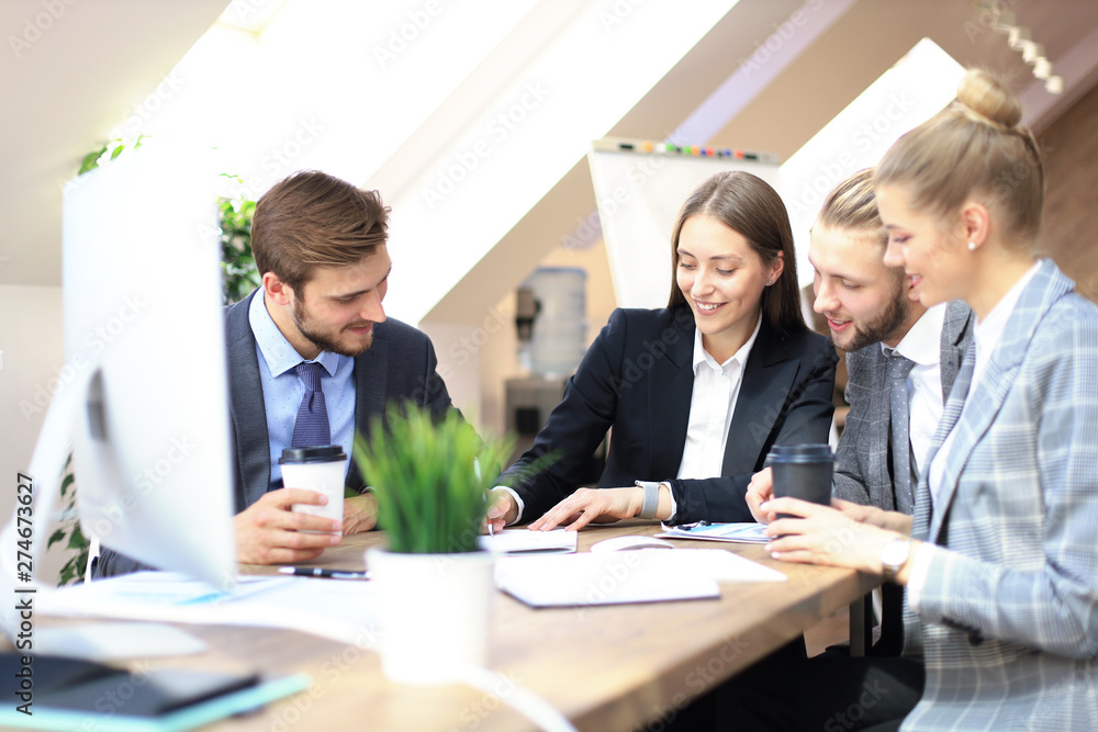 Group of business partners discussing strategies at meeting in office. Group of business partners discussing strategies at meeting in office.