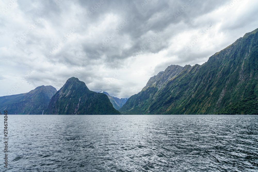 steep coast in the mountains at milford sound, fjordland, new zealand 12