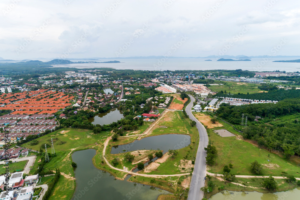 Aerial View from Drone top view of the village in summer season and Roofs of the houses Bird's-eye view of roads