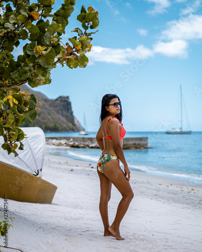 young girl on the beach of Saint Lucia, tropical Island in the Caribbean St Lucia, woman on the ebach watching the ocean on vacation, luxury hollidays photo