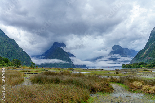 cloud shrouded peaks at famous natural wonder milford sound  new zealand 6