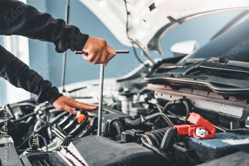 Technician Hands of car mechanic working in auto repair Service and Maintenance car © Nichapa