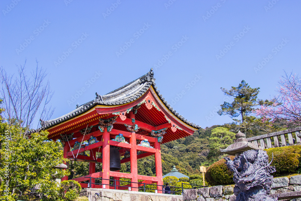 Beautiful bell tower inside Kiyomizu-dera temple. The iconic Buddhist temple in kyoto during cherry blossom time are going to bloom, Japan. Beautiful bell tower inside Kiyomizu-dera temple. The iconic Buddhist temple in kyoto during cherry blossom time are going to bloom, Japan.