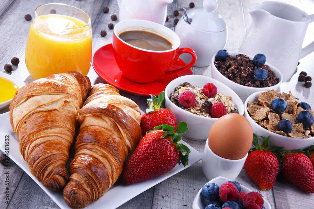 Breakfast served with coffee, juice, croissants and fruits Breakfast served with coffee, juice, croissants and fruits