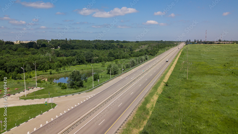 Aerial Shot Of A Highway Passing Through The Rural Countryside