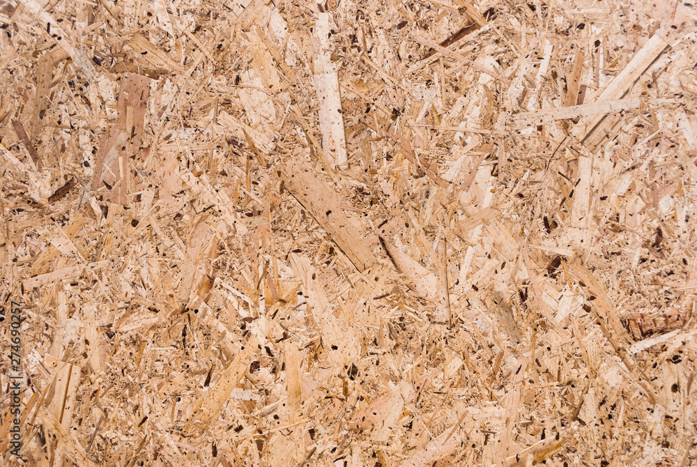 Plywood board texture. Compressed sawdust panel background. Wood surface for interior design and decoration. Plywood board texture. Compressed sawdust panel background. Wood surface for interior design and decoration.