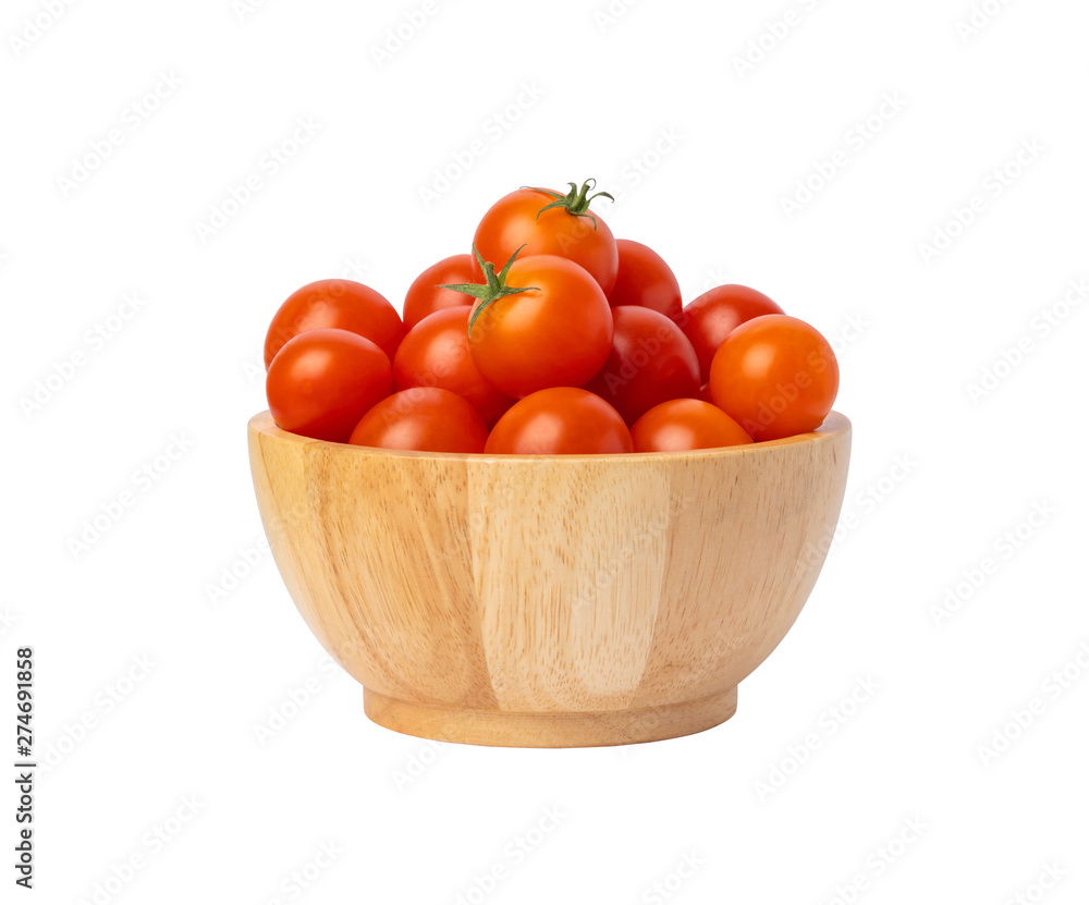 Group red tomatoes in a wooden bowl isolated on the white background Group red tomatoes in a wooden bowl isolated on the white background