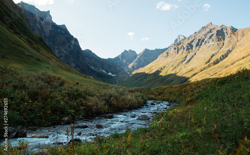 mountains and river in the middle. Beautiful landscape of mountains and rivers. Landscape. Mountain landscape of the river valley. Mountain river, valley stream. River valley in the mountains. 
