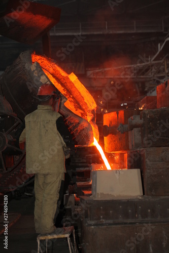 Work in the foundry. molten metal worker at a metallurgical plant
