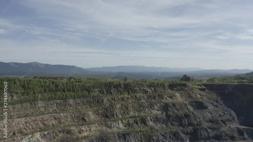 aero flight over a large abandoned quarry, for the extraction of stones, many roads and sections can be seen, the quarry is very deep aero flight over a large abandoned quarry, for the extraction of stones, many roads and sections can be seen, the quarry is very deep