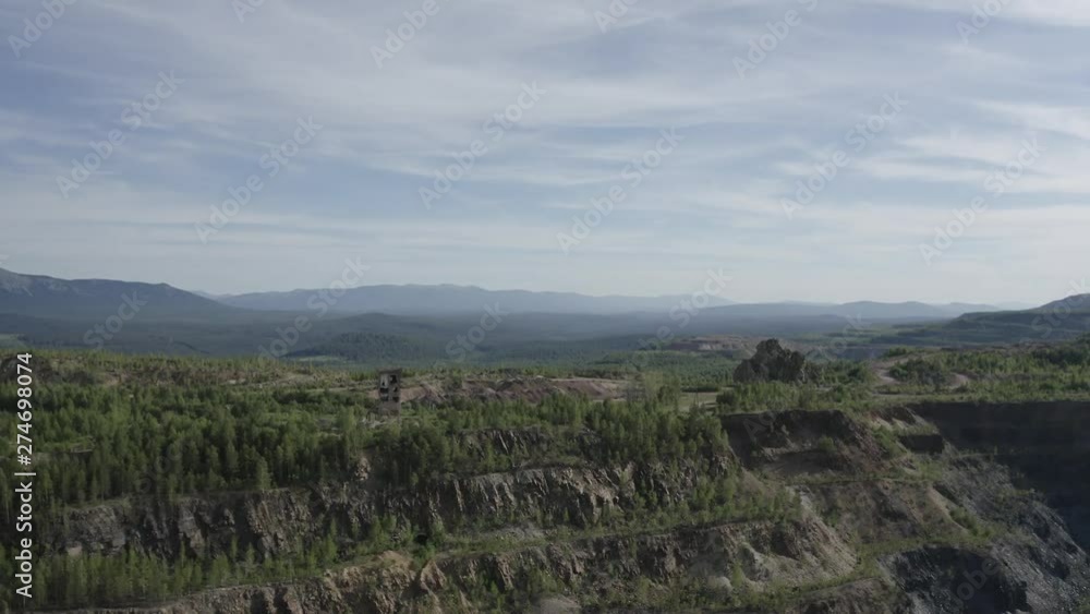 aero flight over a large abandoned quarry, for the extraction of stones, many roads and sections can be seen, the quarry is very deep aero flight over a large abandoned quarry, for the extraction of stones, many roads and sections can be seen, the quarry is very deep