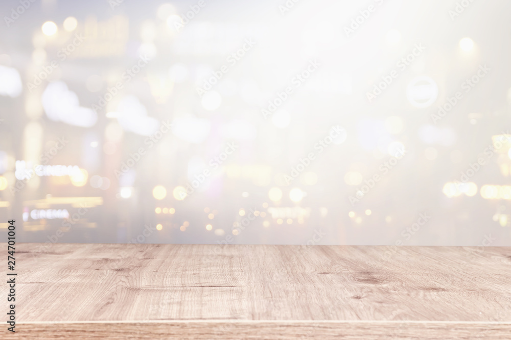 background of wooden table in front of abstract blurred window light background of wooden table in front of abstract blurred window light