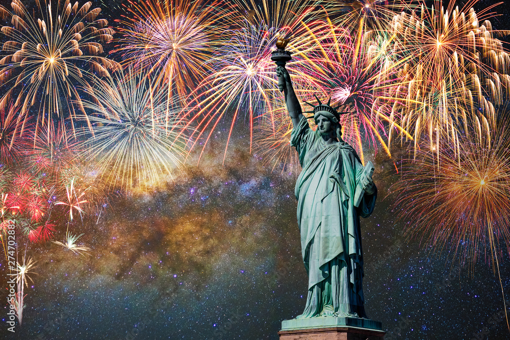 Statue of Liberty over the Multicolor Fireworks Celebrate with the milky way background, 4th of July and Independence day concept