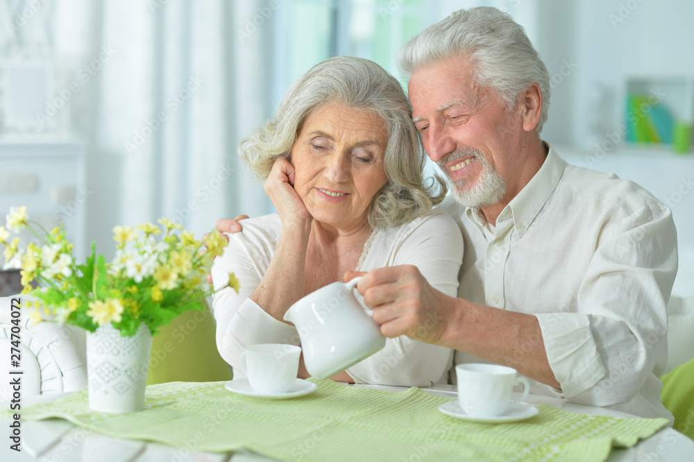 Portrait of happy senior couple drinking tea Portrait of happy senior couple drinking tea