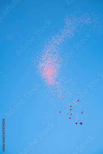 red confetti in the blue sky