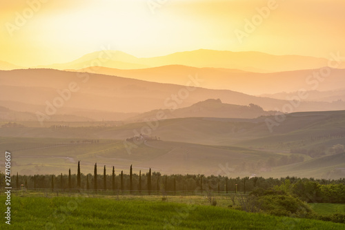 Sunset in a valley of rolling countryside