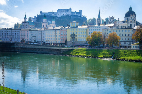 View to river quay and colorful buildings with fortress background in Salzburg Austria at autumn