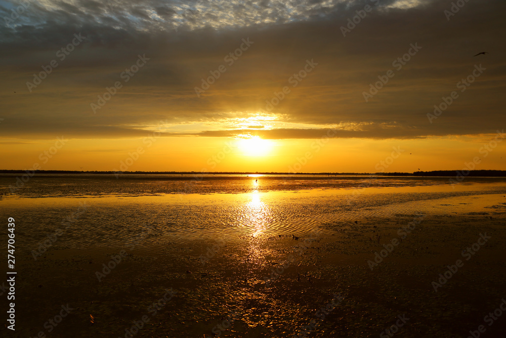 A beautiful sunrise on a lake in Danube Delta A beautiful sunrise on a lake in Danube Delta