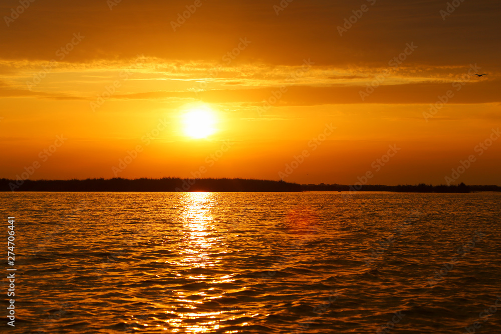 A beautiful sunrise on a lake in Danube Delta A beautiful sunrise on a lake in Danube Delta