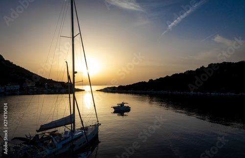 sailing boat in the sunset on bay of Zaklopatica on Lastovo island, Croatia