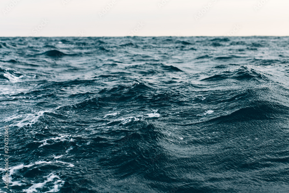 dark blue sea water background, shades of blue in black sea