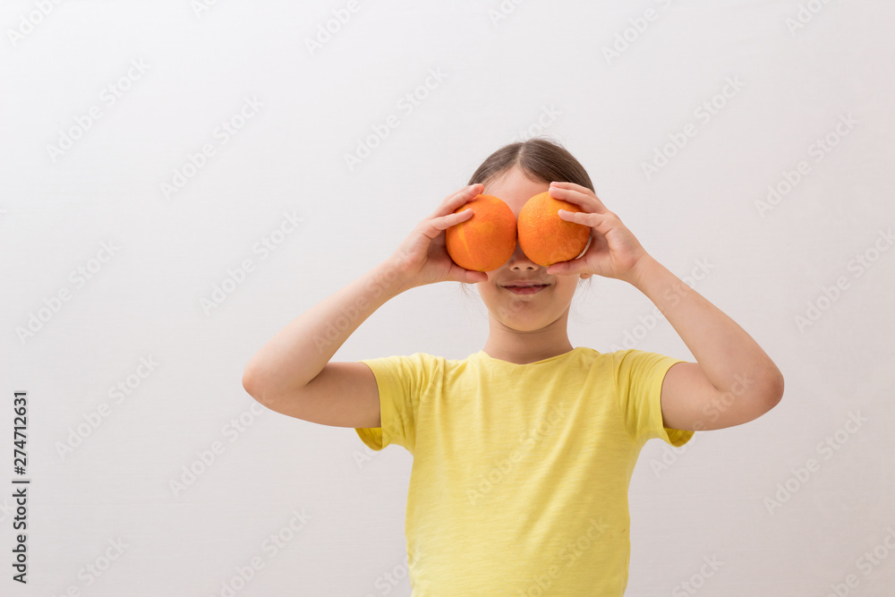 little girl with juicy oranges, baby playing with fruit little girl with juicy oranges, baby playing with fruit