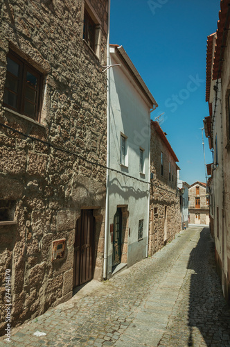 Fototapeta Naklejka Na Ścianę i Meble -  Old houses on a narrow deserted alley