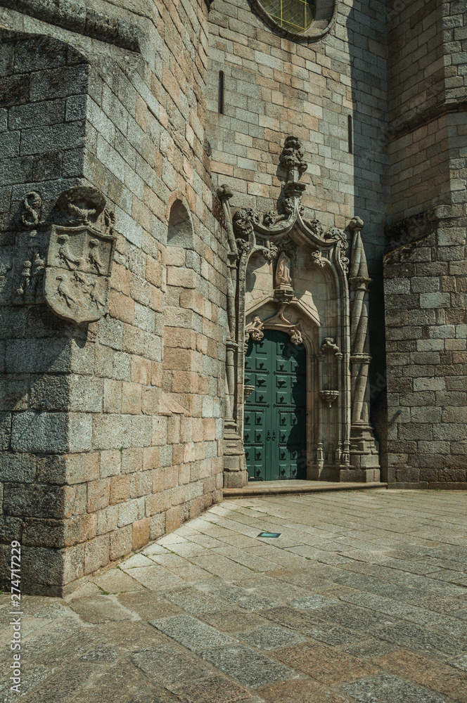 Fototapeta premium Door and stone decoration spiraling column in a Cathedral