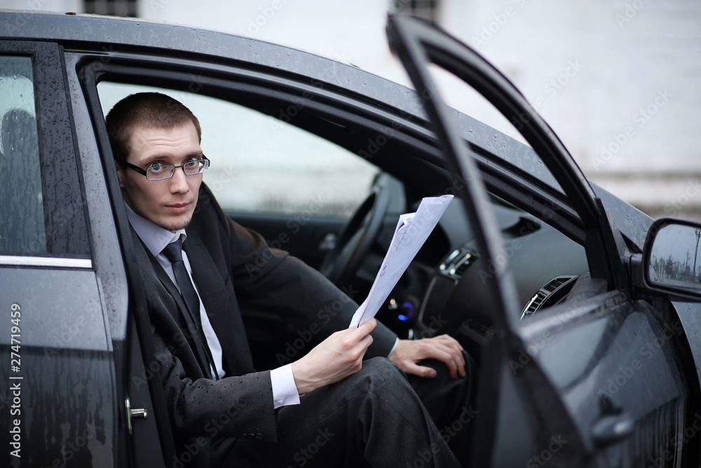 Man in a business suit in the car Man in a business suit in the car
