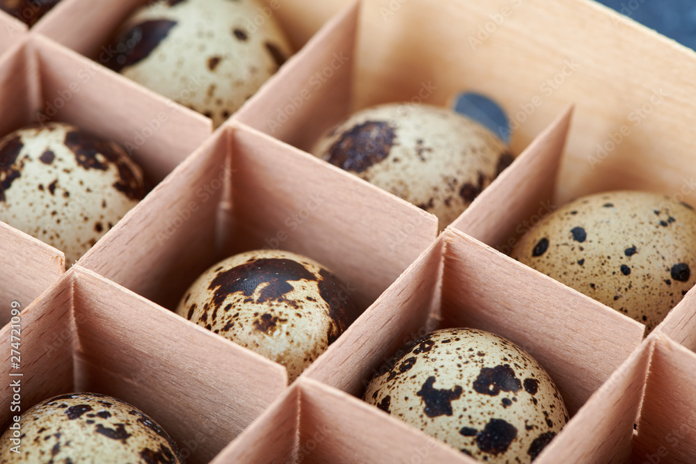 quail eggs in wooden cells from the store