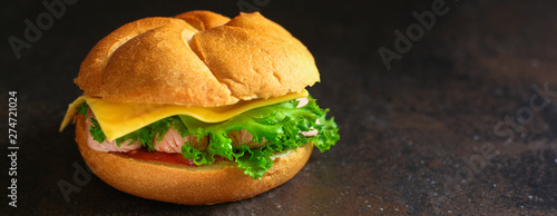 burger with sausages, cf, lettuce, tomato sauce (snack sandwich, kaiser bun). top food background. copy space photo