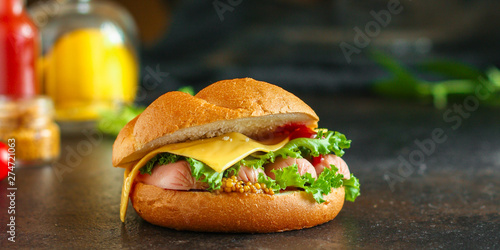 burger with sausages, cf, lettuce, tomato sauce (snack sandwich, kaiser bun). top food background. copy space photo