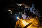 Workers are grooving with carbon welding wires With sparksWorkers are grooving with carbon welding wires With sparks