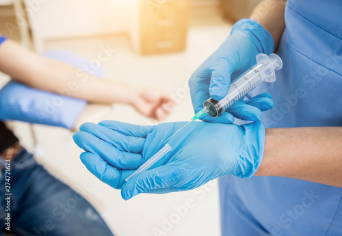 Nurse taking blood sample. Medical equipment.